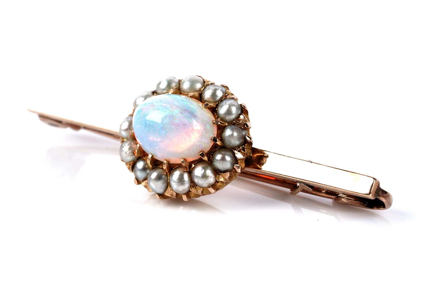 Lot 118 - An opal and seed pearl cluster bar brooch