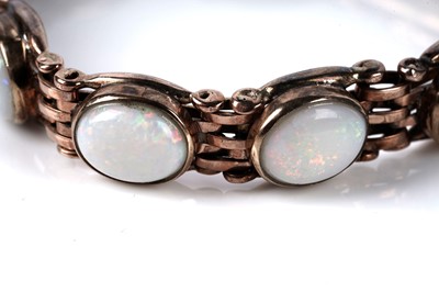 Lot 129 - An opal cabochon bracelet