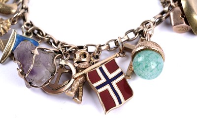 Lot 108 - A yellow gold charm bracelet