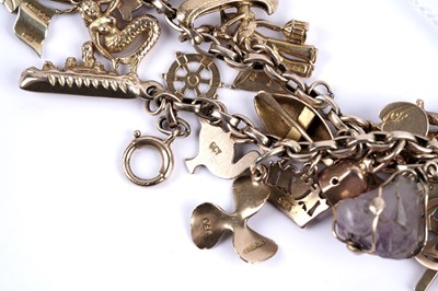 Lot 108 - A yellow gold charm bracelet