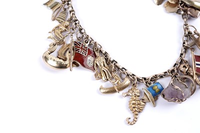 Lot 108 - A yellow gold charm bracelet
