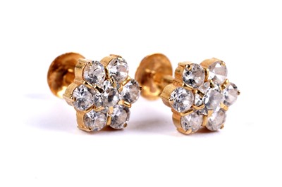 Lot 40 - A pair of Indian white gem stone set flower cluster earrings