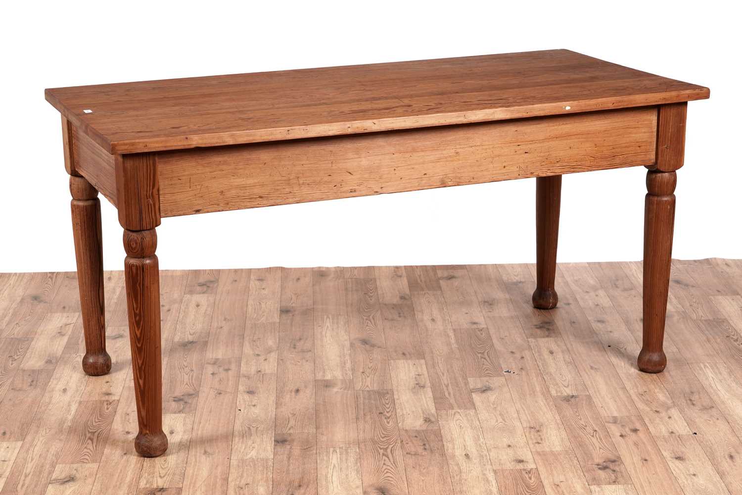 Lot 40 - A vintage pitch pine farmhouse dining table