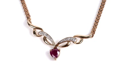 Lot 603 - A ruby and diamond drop pendant necklet