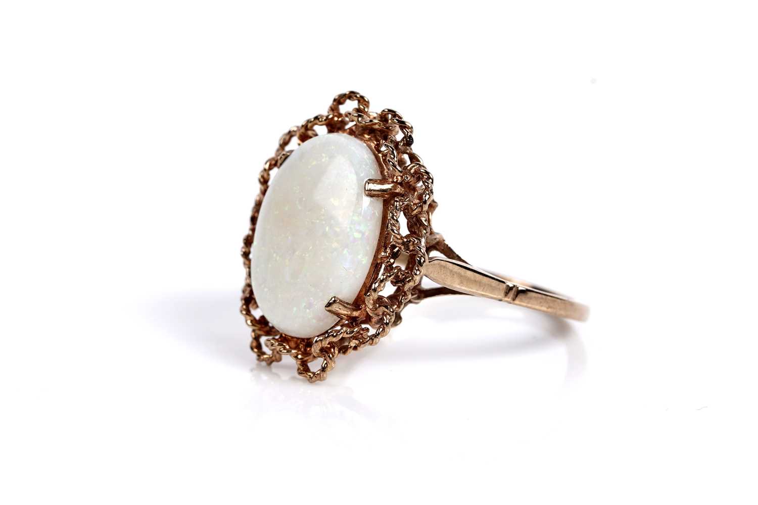 Lot 583 - An opal cabochon cocktail ring