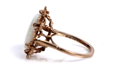 Lot 583 - An opal cabochon cocktail ring