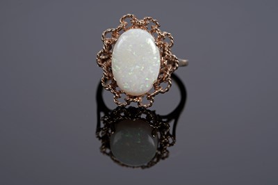 Lot 583 - An opal cabochon cocktail ring