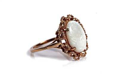 Lot 583 - An opal cabochon cocktail ring