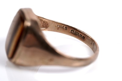 Lot 585 - Two tiger's eye quartz signet rings