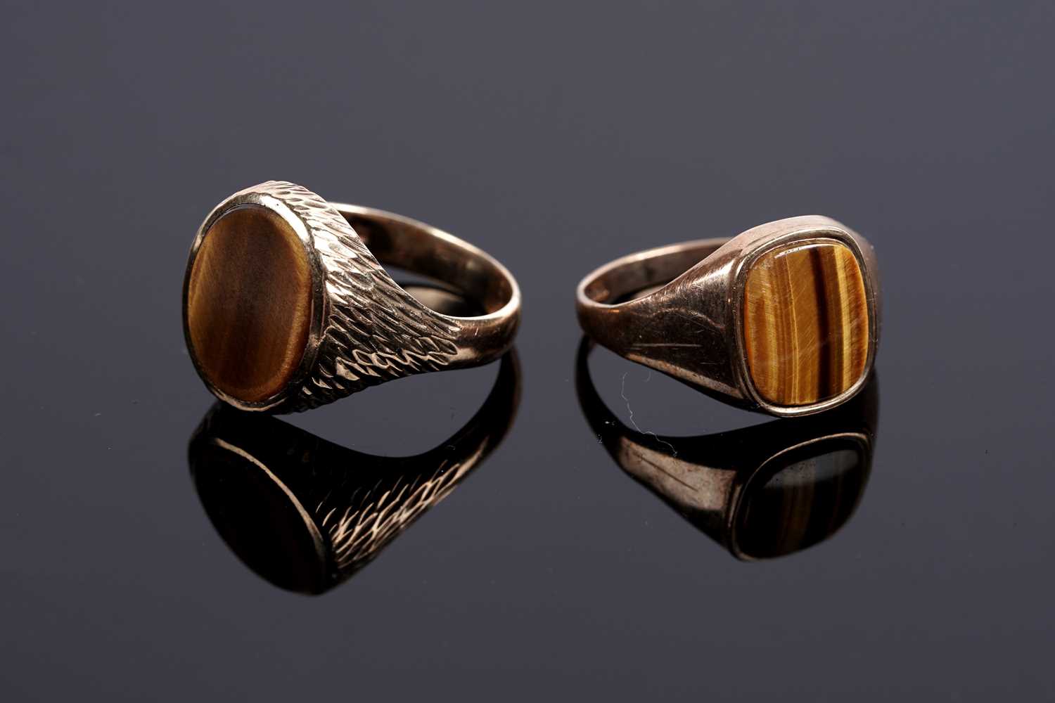 Lot 585 - Two tiger's eye quartz signet rings
