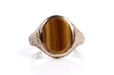 Lot 585 - Two tiger's eye quartz signet rings