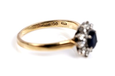 Lot 602 - A sapphire and diamond cluster ring