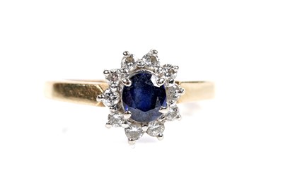Lot 602 - A sapphire and diamond cluster ring