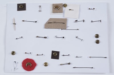 Lot 48 - A display of British and other military lapel badges, sweetheart badges, and other items