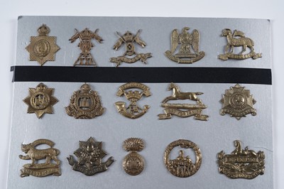 Lot 57 - A display of mostly First World War period British military cap badges