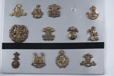 Lot 57 - A display of mostly First World War period British military cap badges