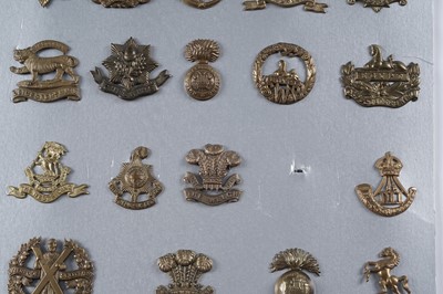 Lot 57 - A display of mostly First World War period British military cap badges
