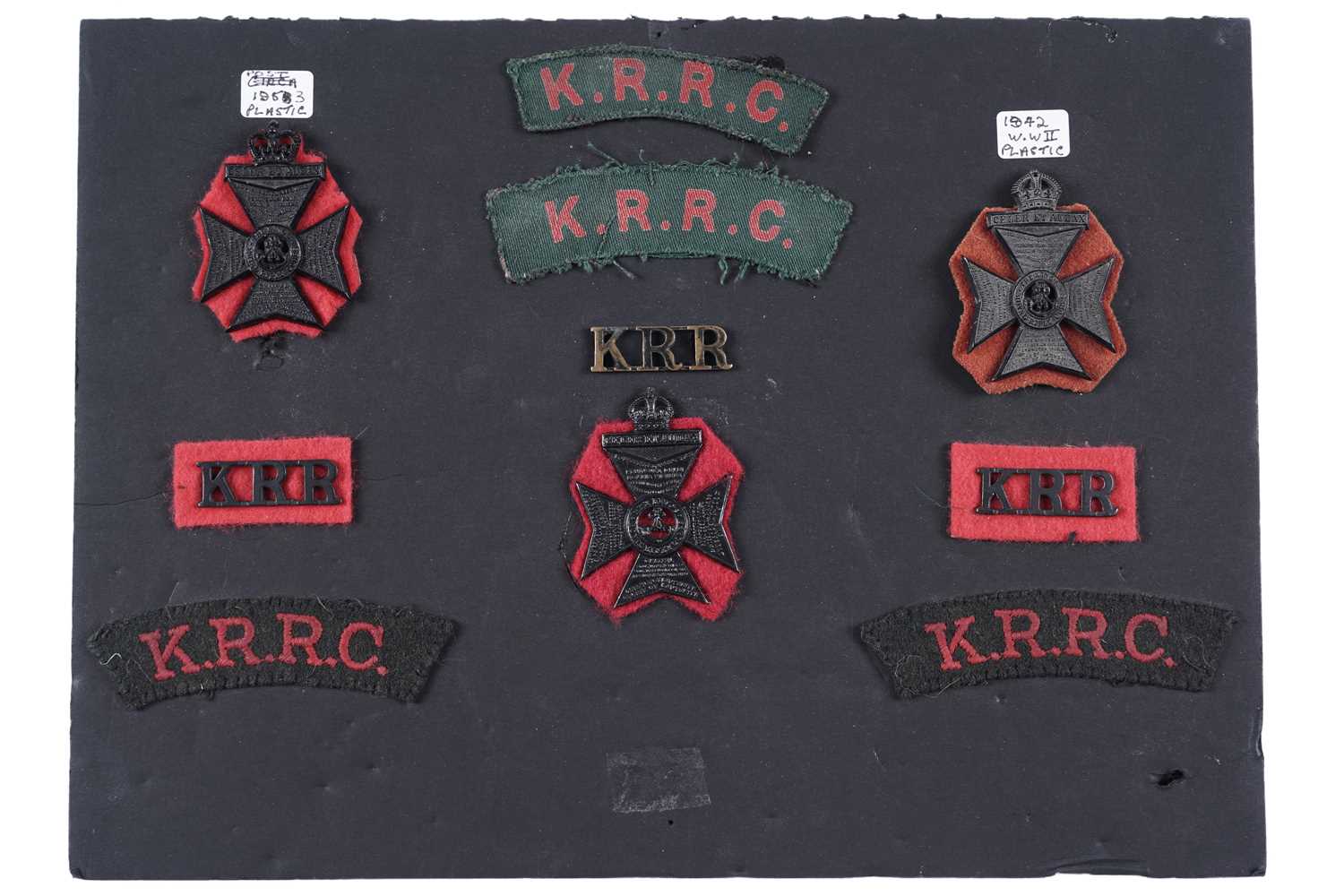 Lot 59 - The King’s Royal Rifle Corps cap badges, titles and cloth badges