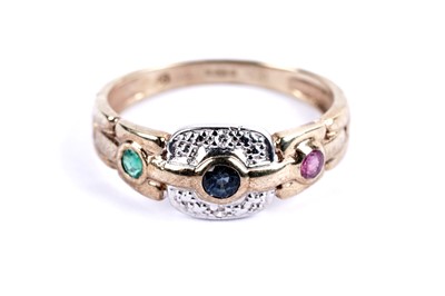 Lot 100 - An emerald, sapphire, ruby and diamond dress ring