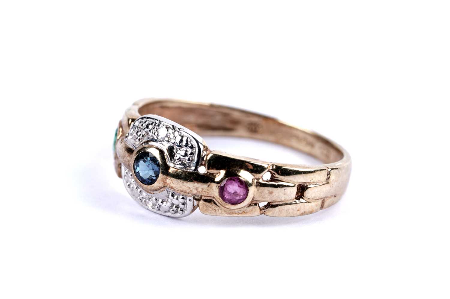 Lot 100 - An emerald, sapphire, ruby and diamond dress ring