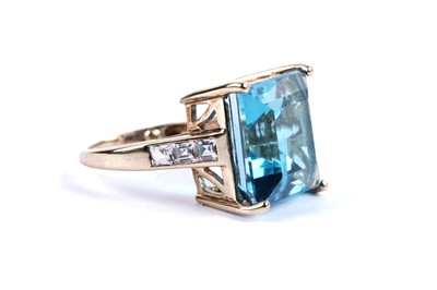 Lot 102 - A topaz and white sapphire cocktail ring