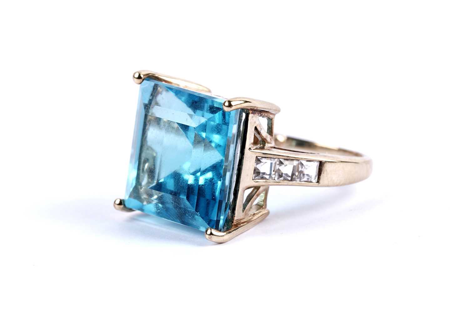 Lot 102 - A topaz and white sapphire cocktail ring