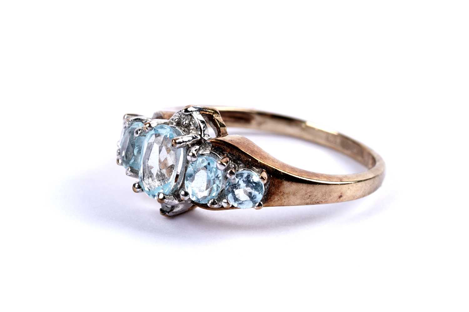 Lot 103 - A topaz and diamond dress ring