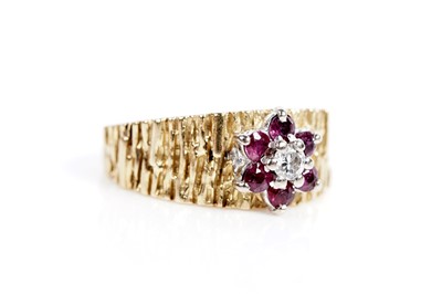Lot 618 - A ruby and diamond flower cluster ring
