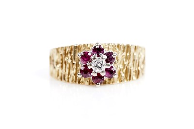 Lot 618 - A ruby and diamond flower cluster ring
