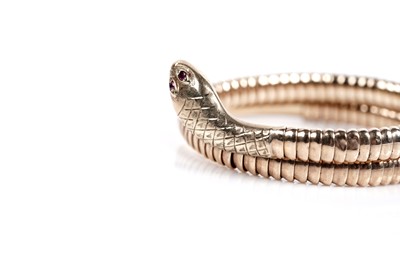 Lot 638 - A 9ct yellow gold snake pattern bangle