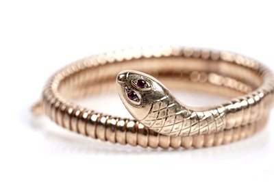 Lot 638 - A 9ct yellow gold snake pattern bangle
