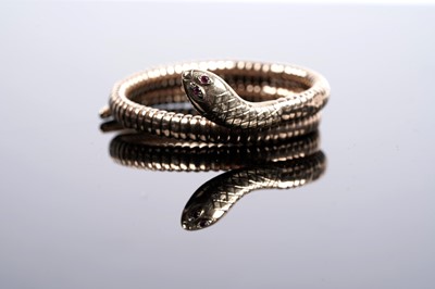 Lot 638 - A 9ct yellow gold snake pattern bangle