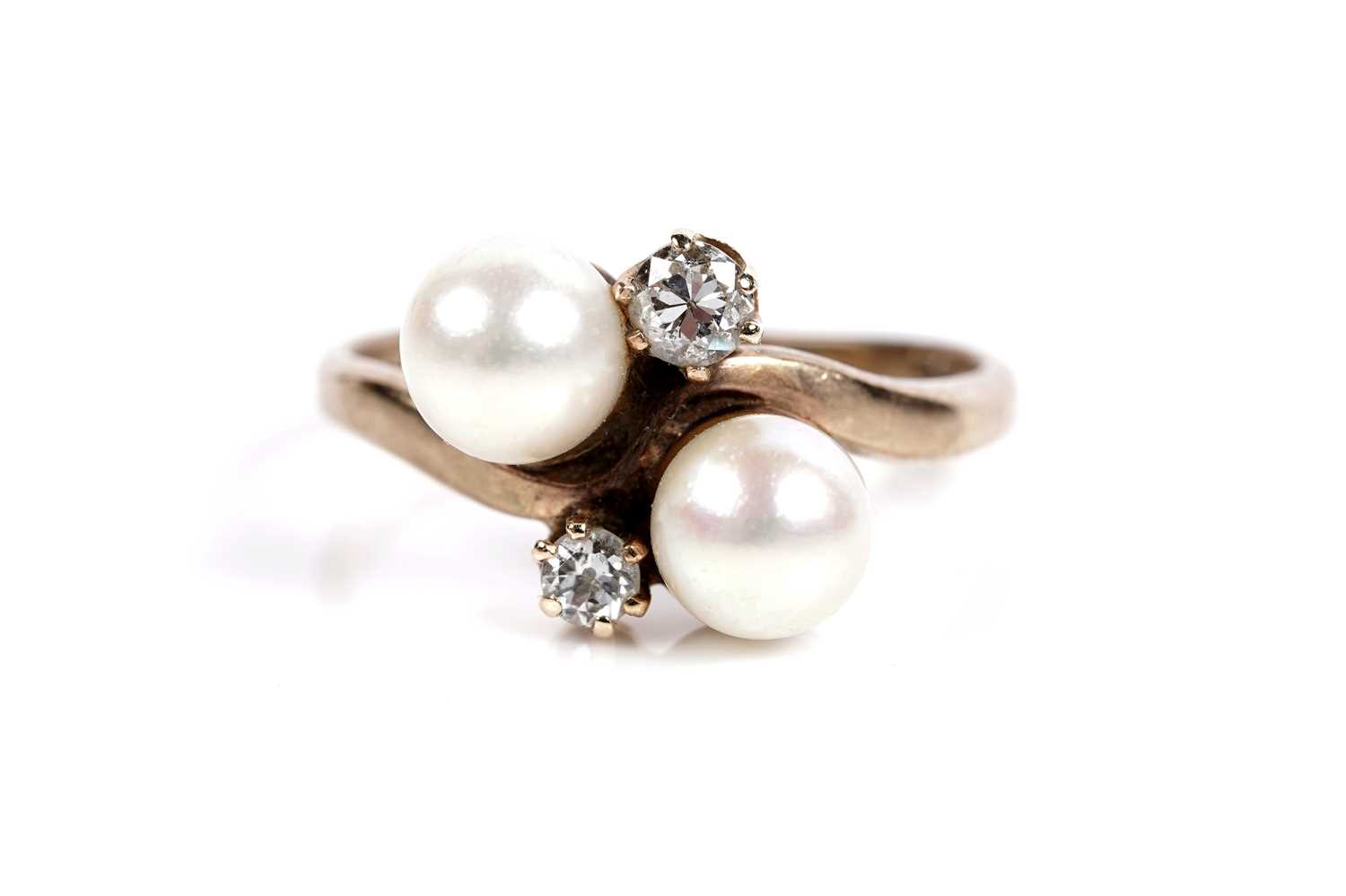 Lot 643 - A cultured pearl and diamond dress ring