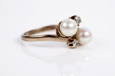 Lot 643 - A cultured pearl and diamond dress ring