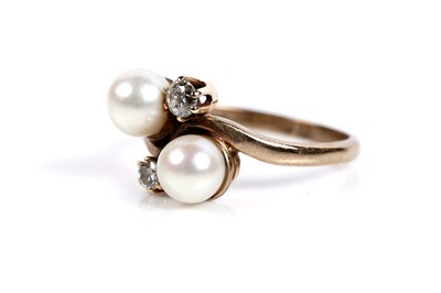 Lot 643 - A cultured pearl and diamond dress ring