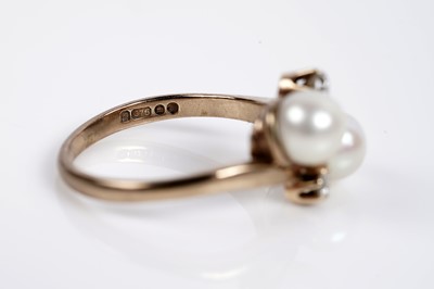 Lot 643 - A cultured pearl and diamond dress ring
