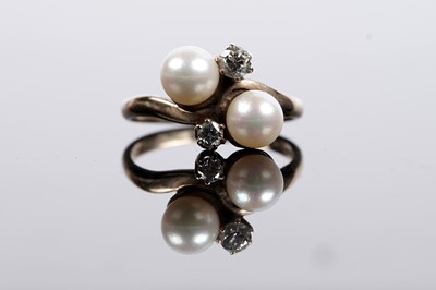 Lot 643 - A cultured pearl and diamond dress ring
