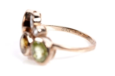 Lot 607 - A sphene and white stone dress ring