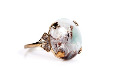 Lot 610 - A circular cabochon dress ring