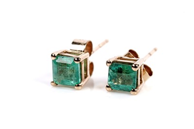 Lot 614 - A pair of emerald and white stone drop earrings; and a a pair of emerald stud earrings