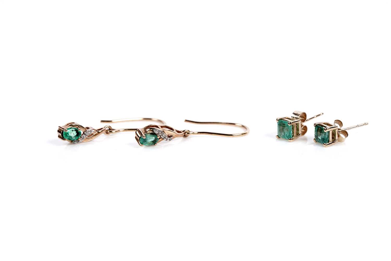 Lot 614 - A pair of emerald and white stone drop earrings; and a a pair of emerald stud earrings