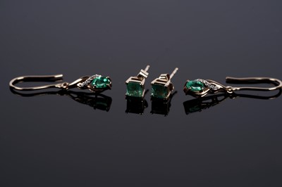 Lot 614 - A pair of emerald and white stone drop earrings; and a a pair of emerald stud earrings