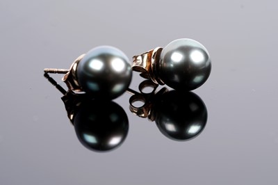 Lot 615 - A pair of cultured black pearl earrings