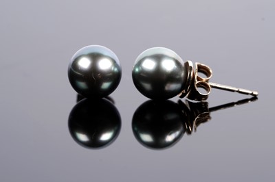 Lot 615 - A pair of cultured black pearl earrings