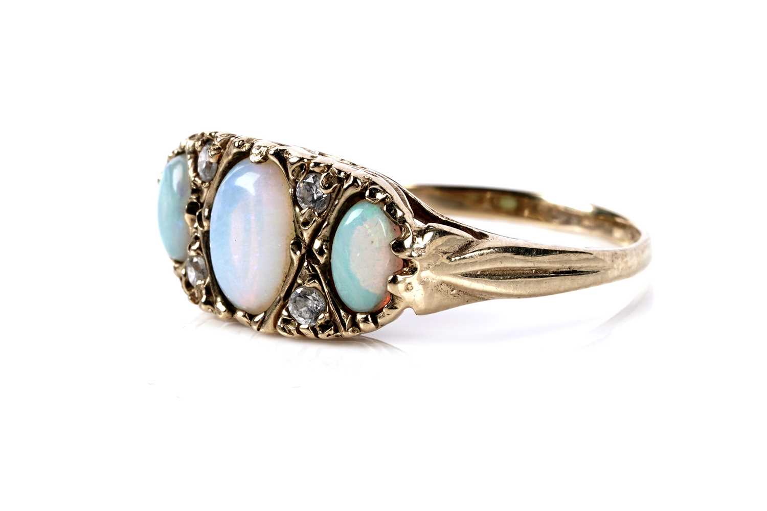 Lot 139 - An opal and diamond dress ring