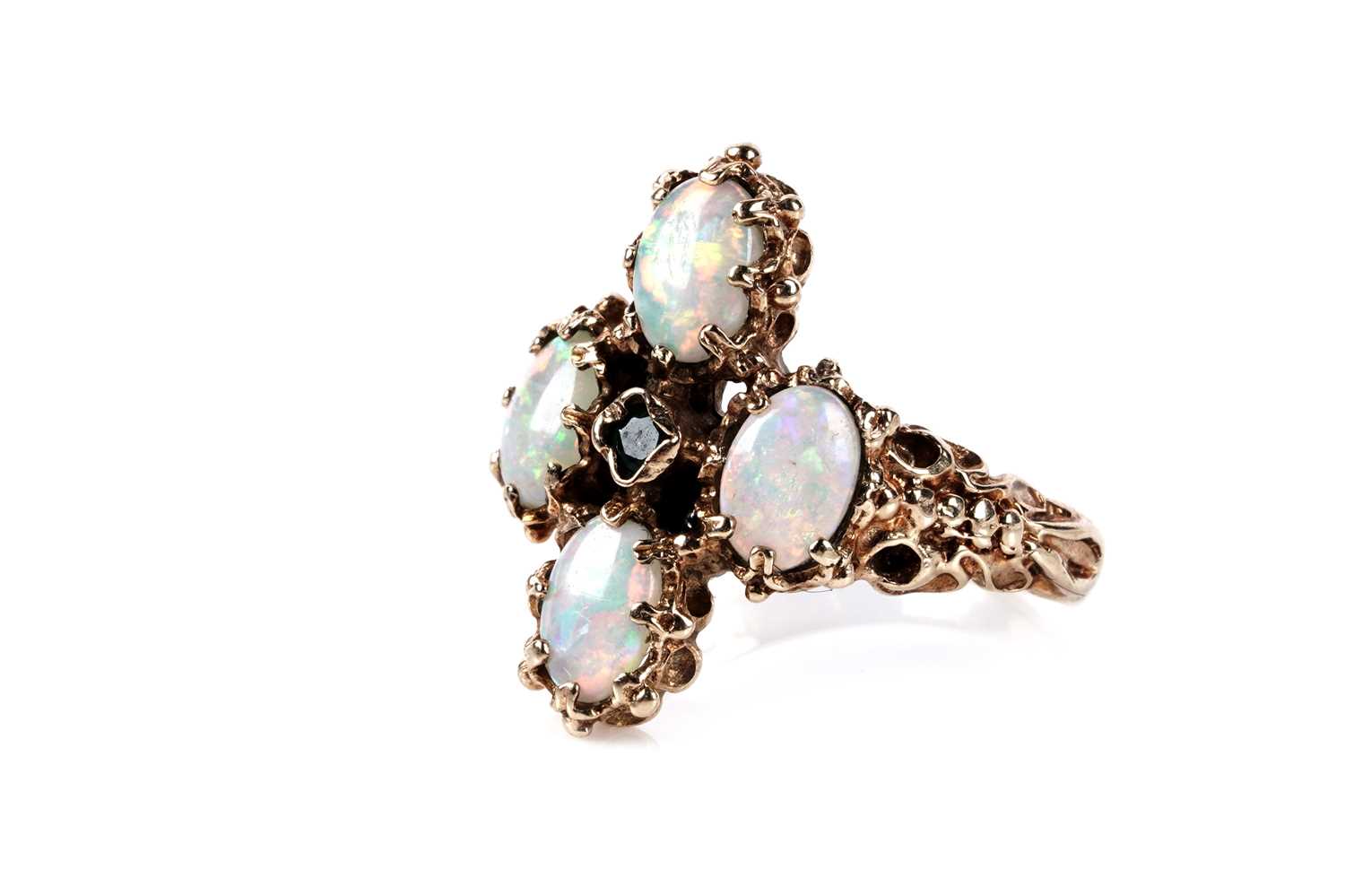 Lot 141 - An opal and emerald dress ring