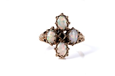 Lot 141 - An opal and emerald dress ring