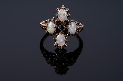 Lot 141 - An opal and emerald dress ring