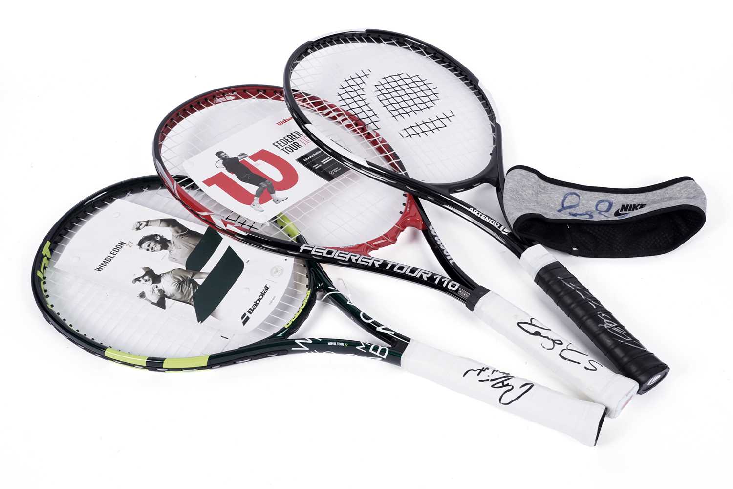 Lot 498 - Three autographed tennis racquets; and a Nike headband signed by Roger Federer