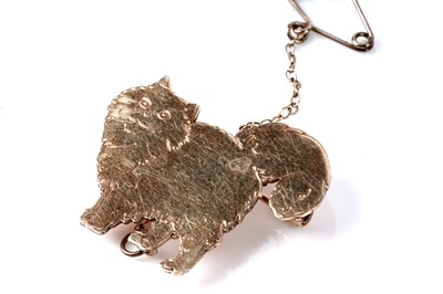 Lot 153 - A 9ct rose gold cat pattern brooch